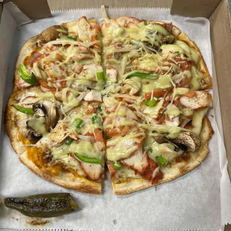 Chicken Tikka Naan Pizza.
